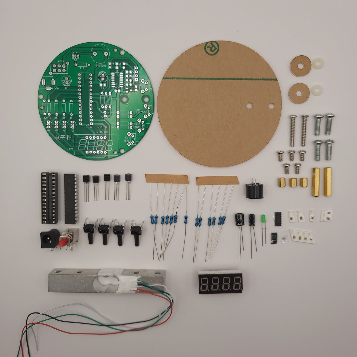 Electronic components and parts laid out on a white surface