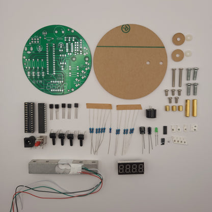 Electronic components and parts laid out on a white surface