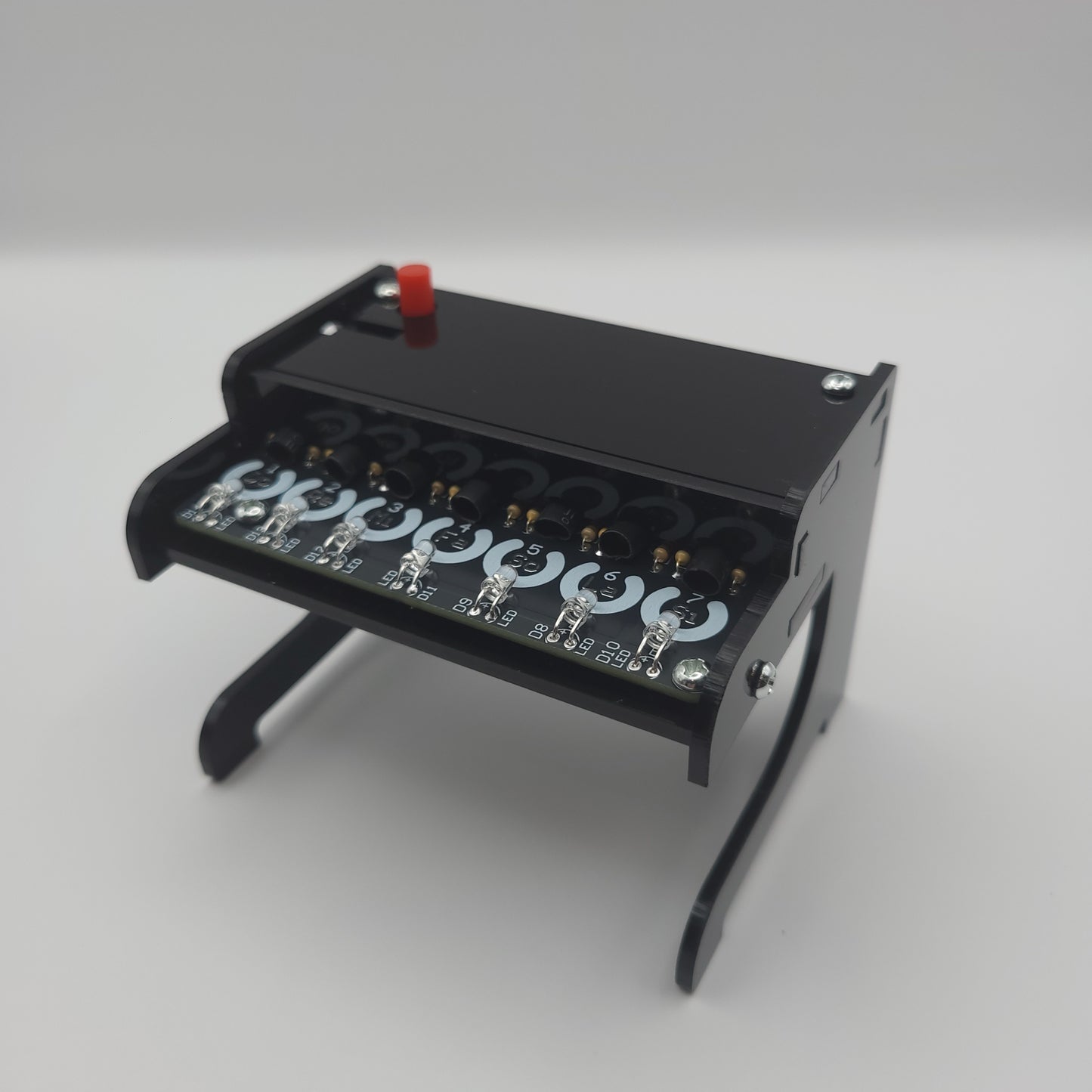 Black Piano Soldering Kit with multiple lights on a gray background