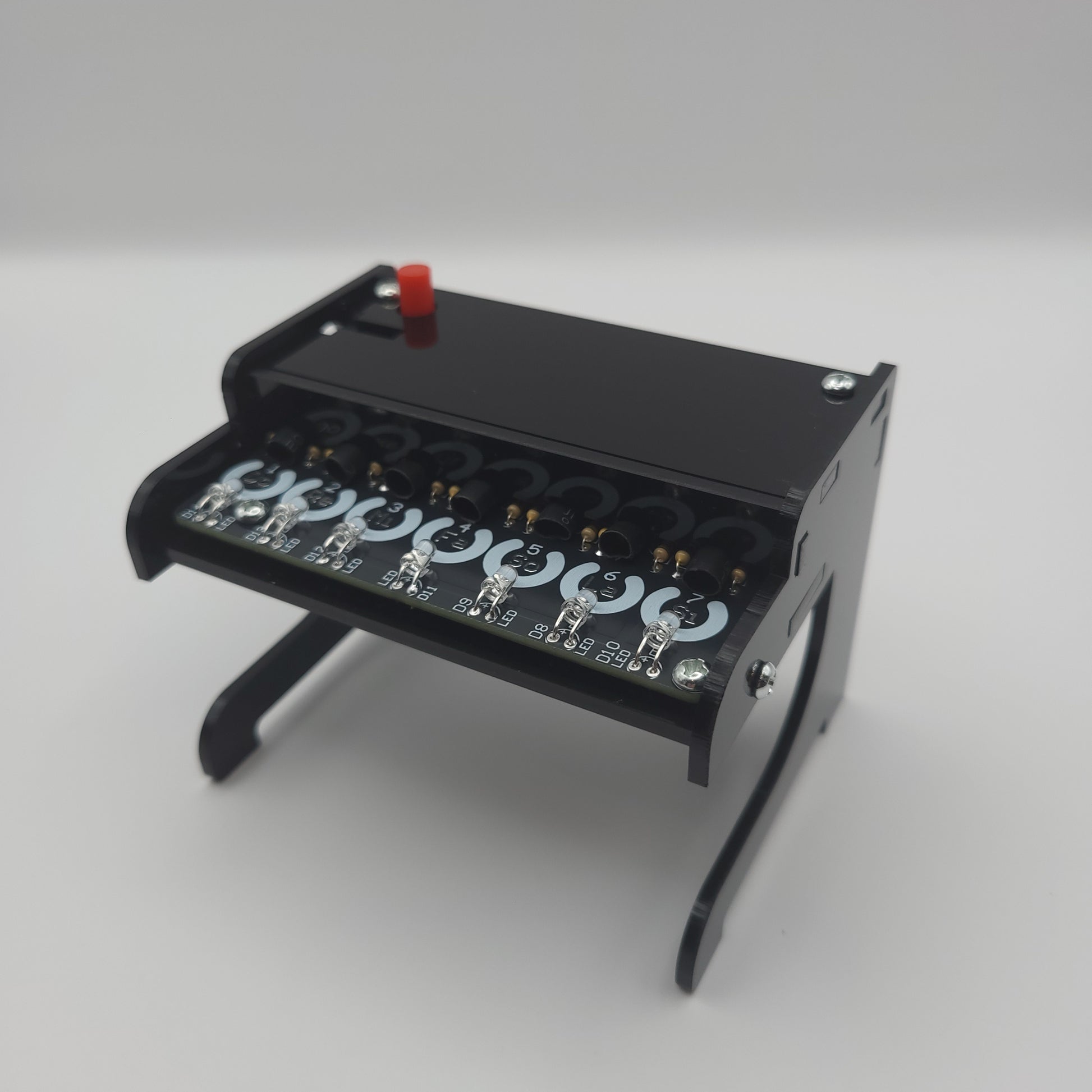 Black Piano Soldering Kit with multiple lights on a gray background