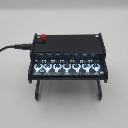 Black Piano Soldering Kit with multiple lights on gray background
