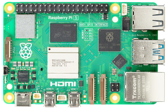 Raspberry Pi 5 board with various components on a green background