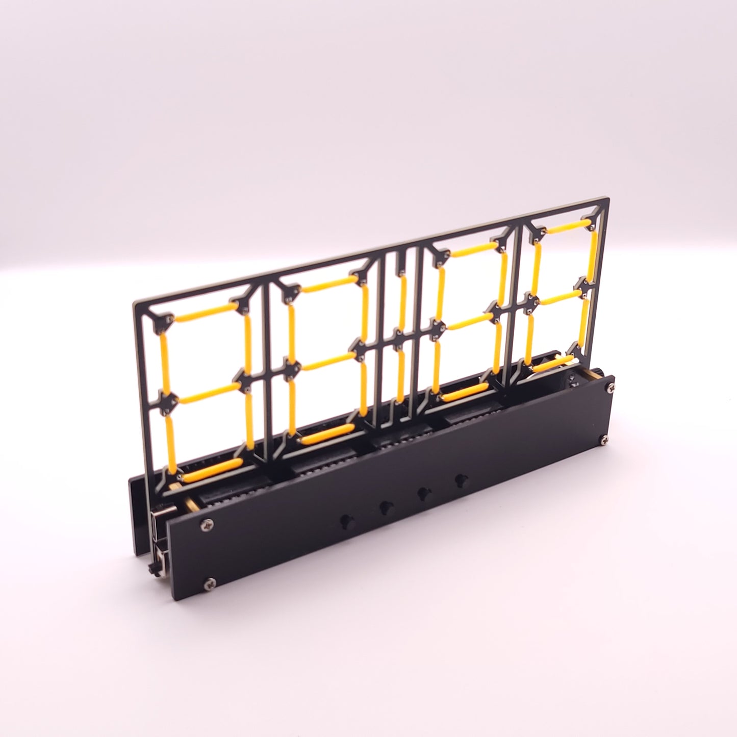 Black and yellow metal grid structure on a white background
