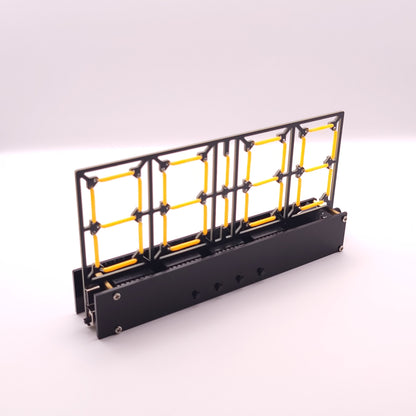 Black and yellow metal grid structure on a white background
