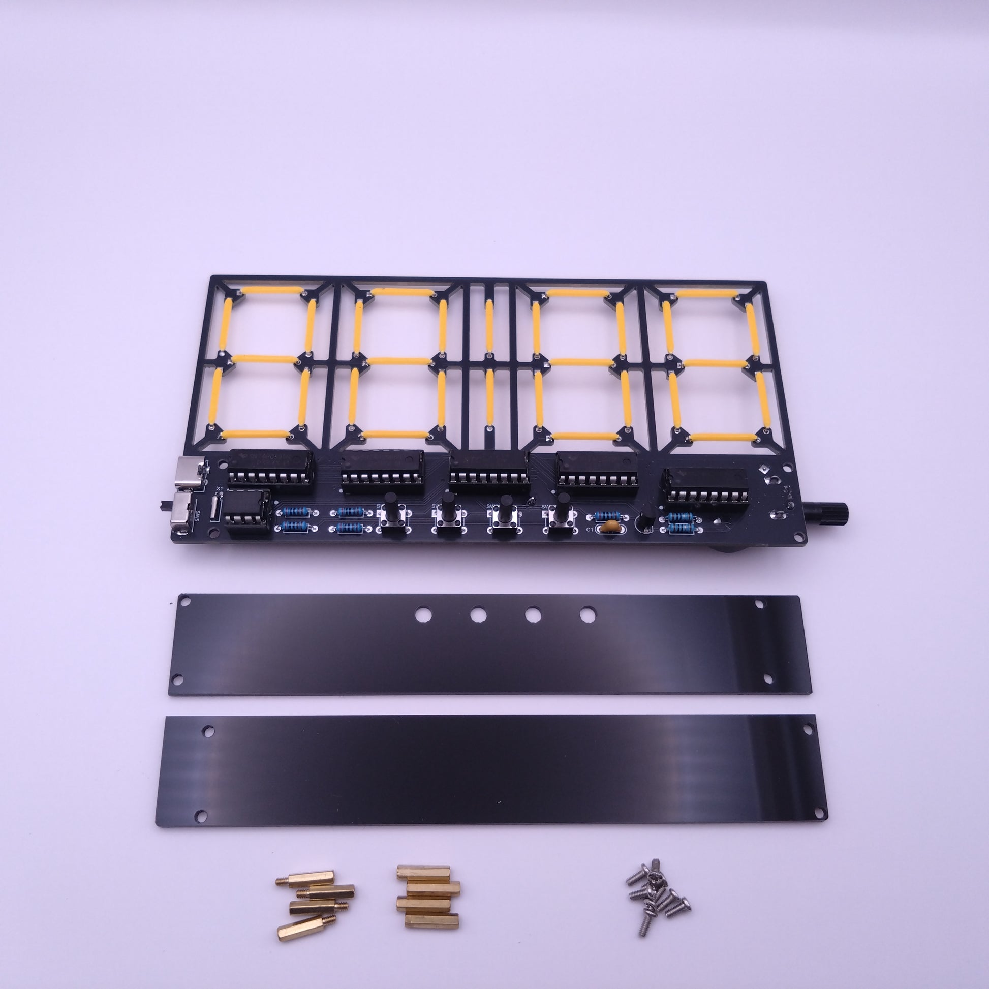 Electronic components kit featuring acrylic plates screws and a pcb