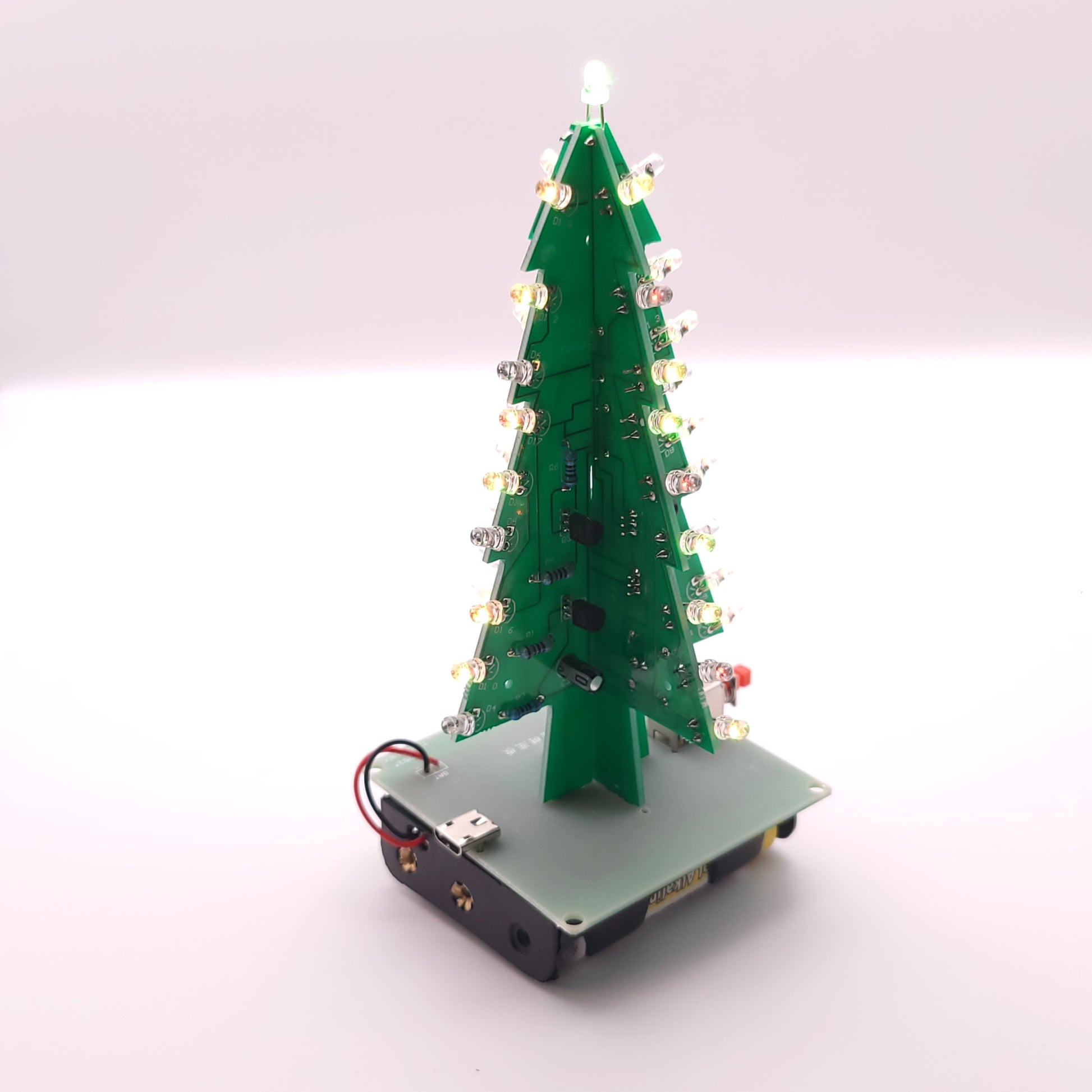 Christmas tree-shaped LED light on a white background