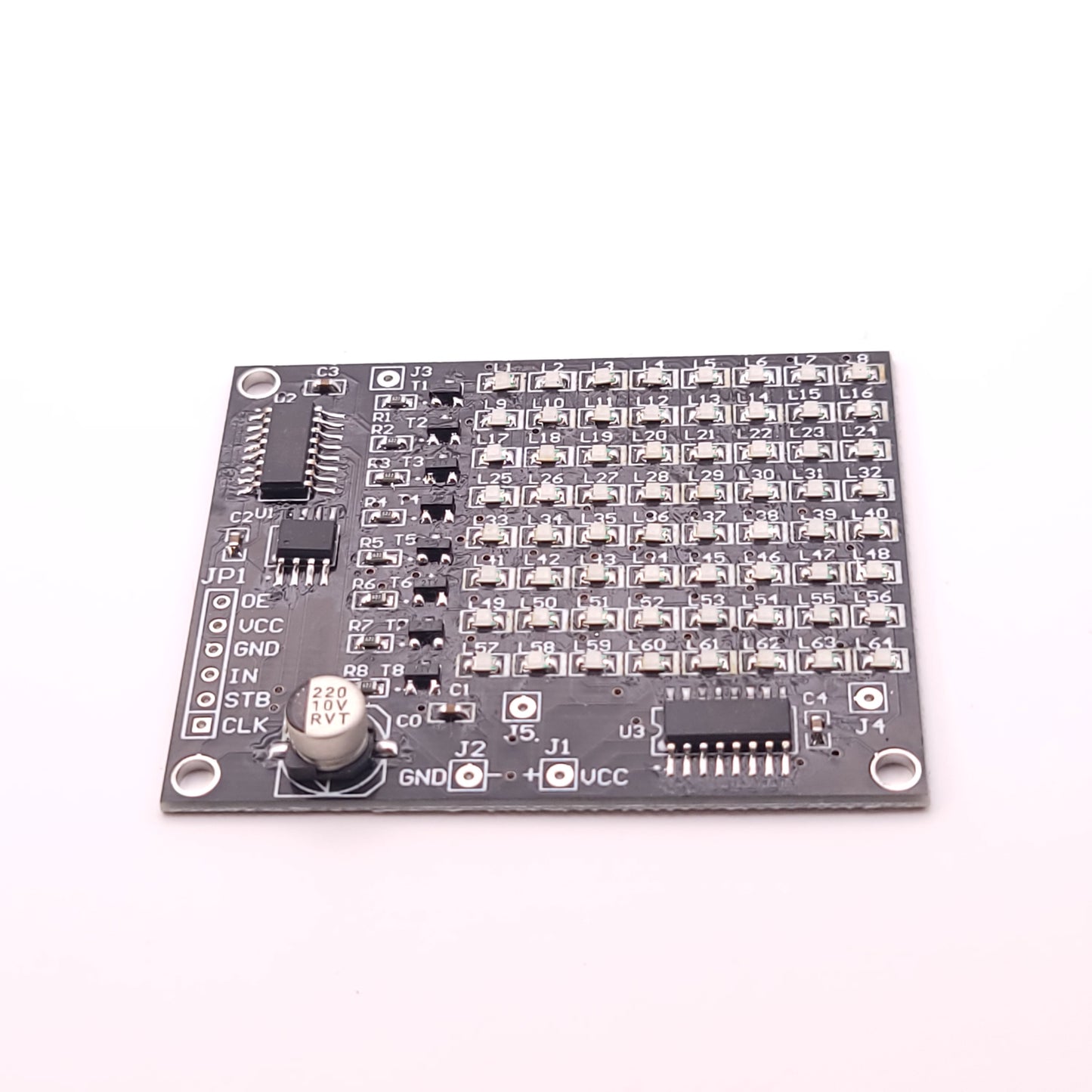 Electronic circuit board with various components on a white background