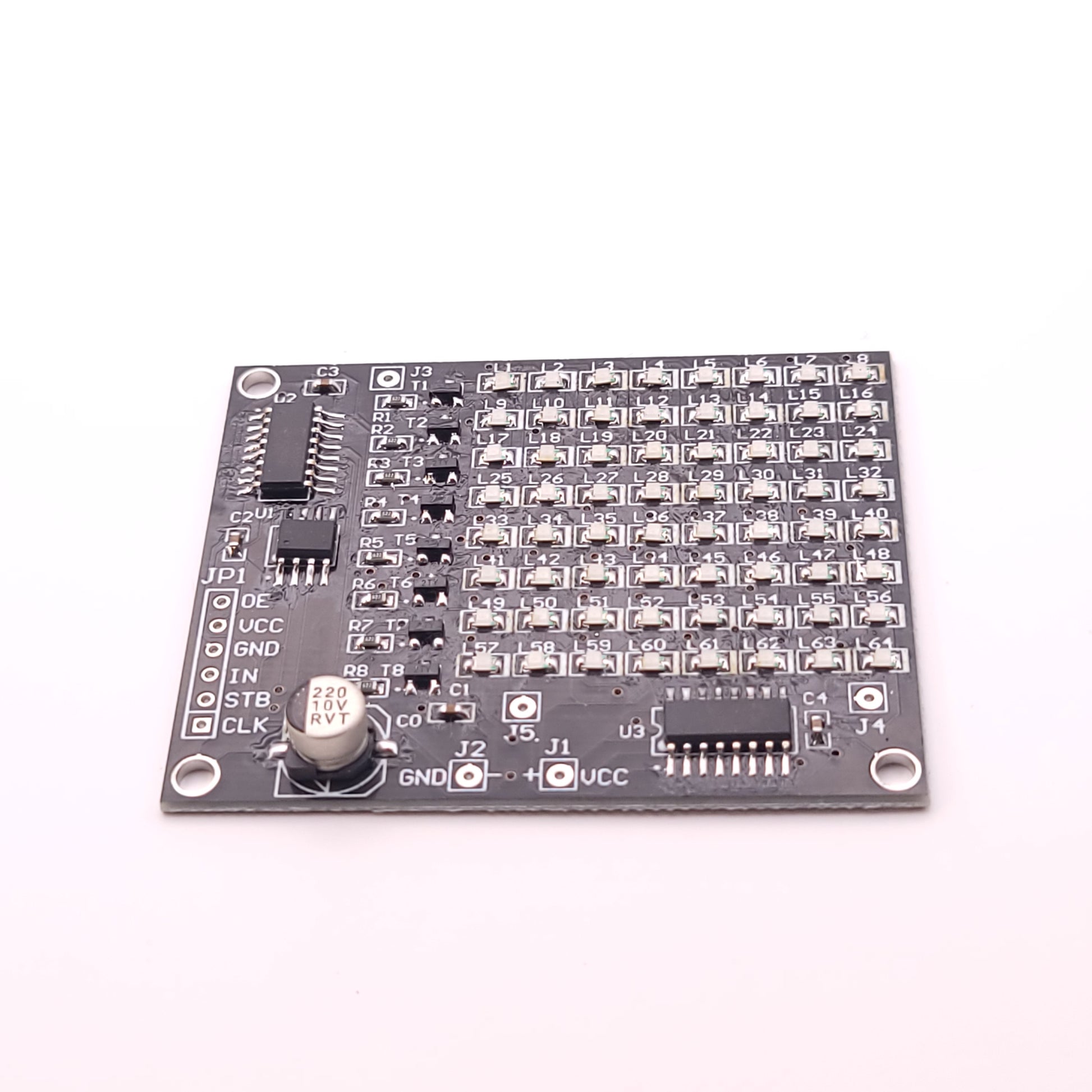 Electronic circuit board with various components on a white background