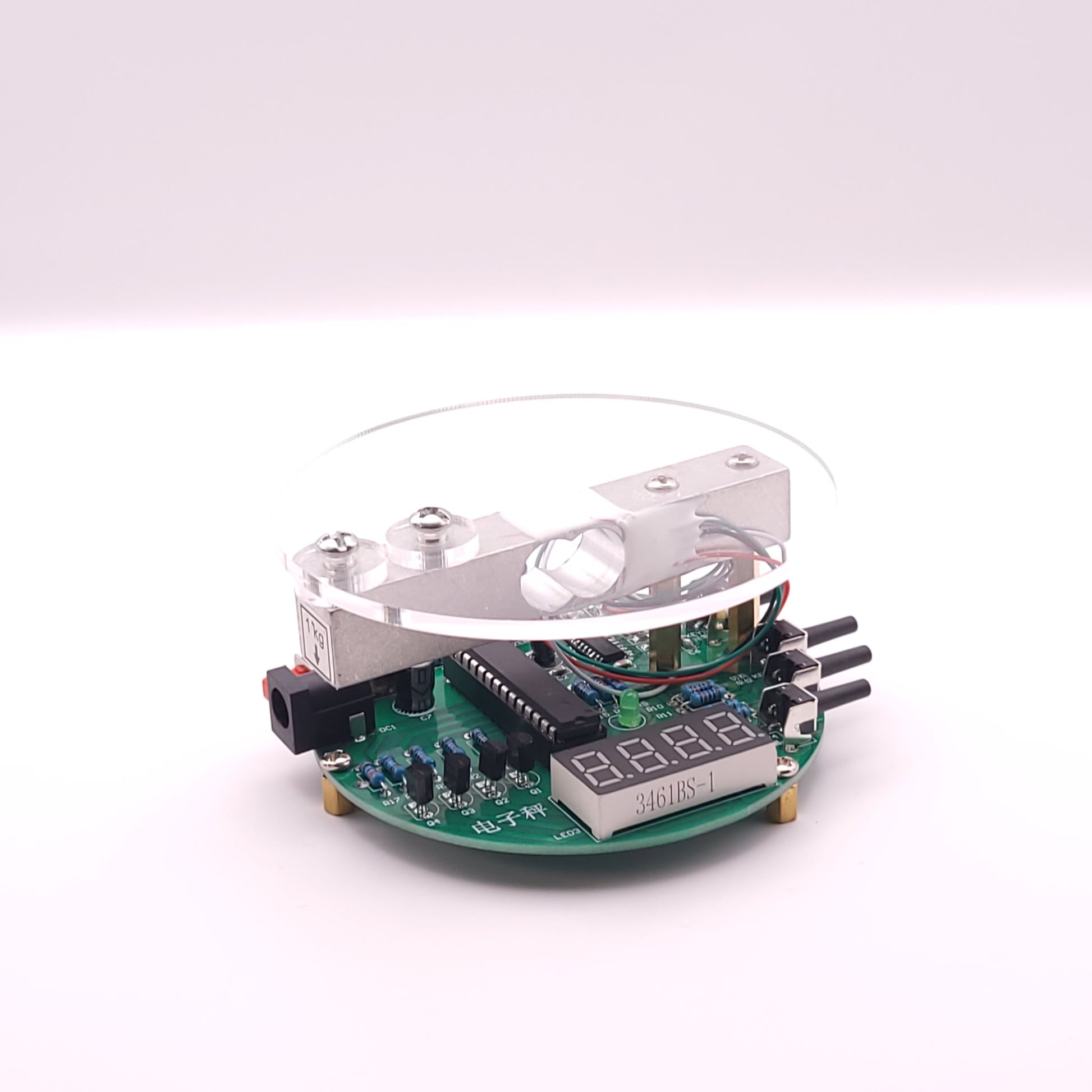 Electronic circuit board with a digital display on a white background