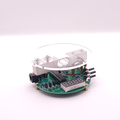 Electronic circuit board with a digital display on a white background